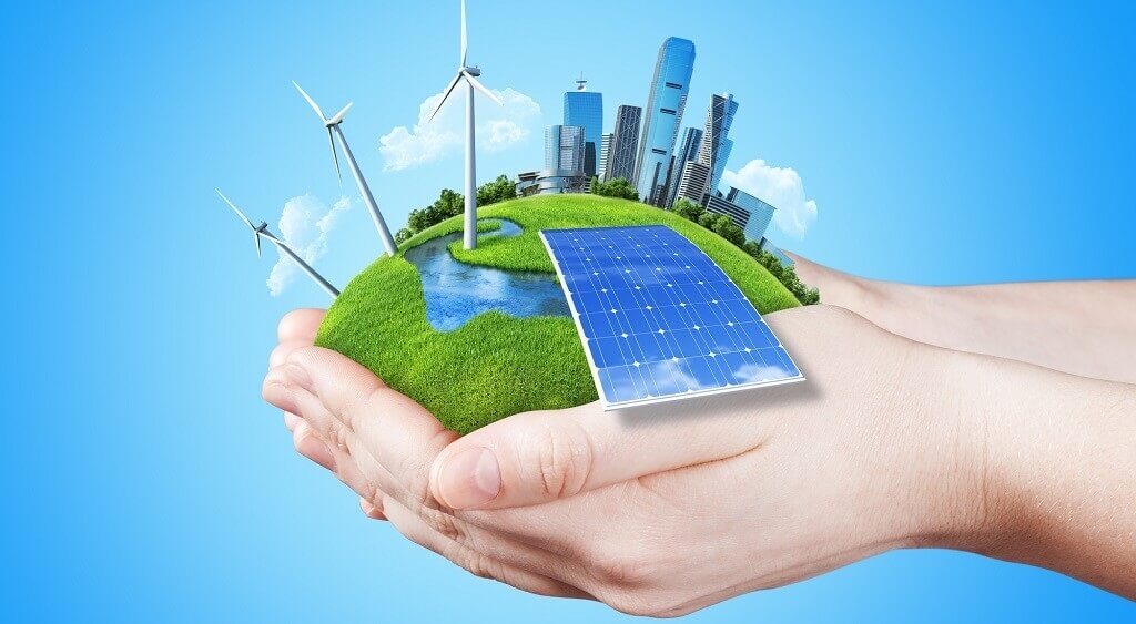 2 handen die gras vasthouden met daarop zonnepanelen, windmolens en wolkenkrabbers